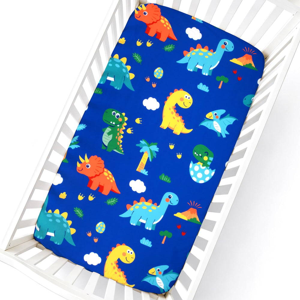 Cloele pattern closeup shows vibrant dinosaur colors for a playful nursery.