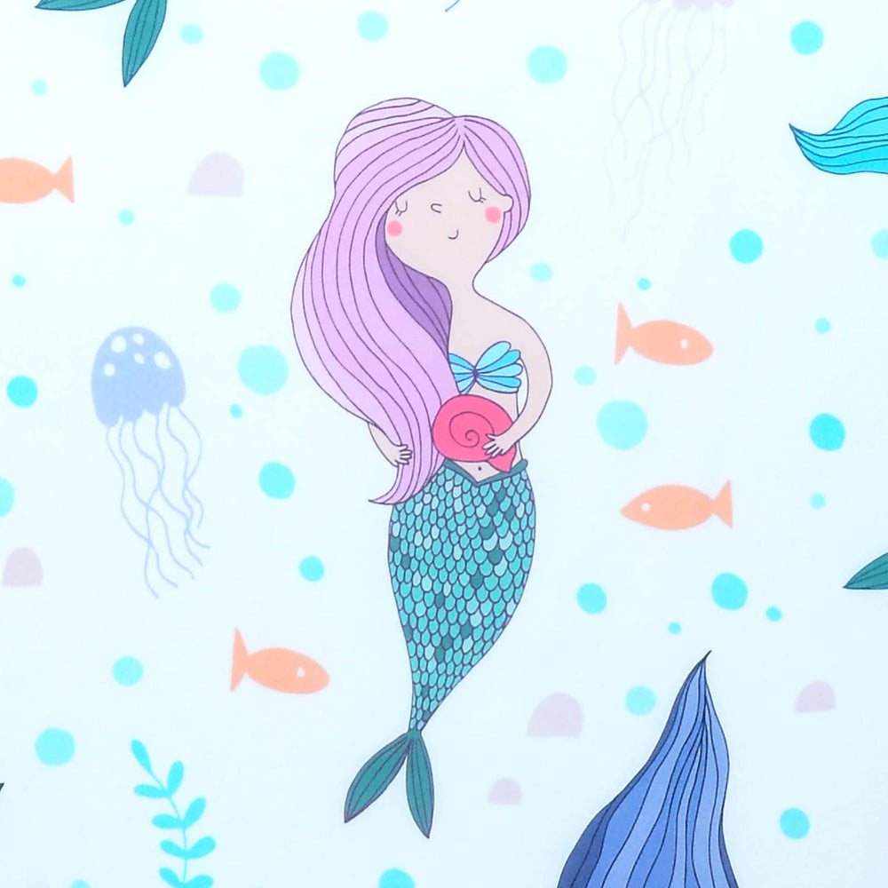 Close-up of soft, breathable polyester fabric from Cloele Mermaids crib sheet.