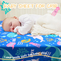 Cloele Ocean whale-pattern crib sheet fits standard crib mattresses securely.