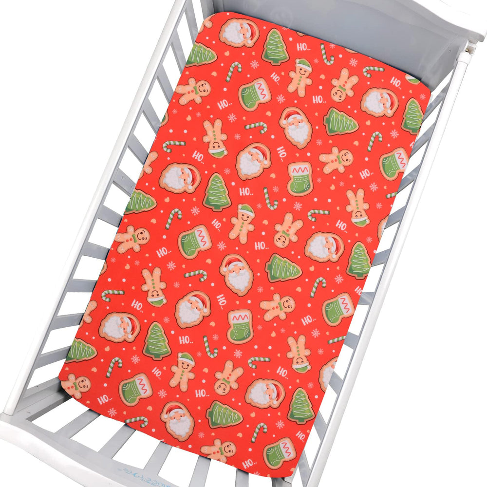 Cloele Santa Baby crib sheet offers festive style with soft polyester comfort.