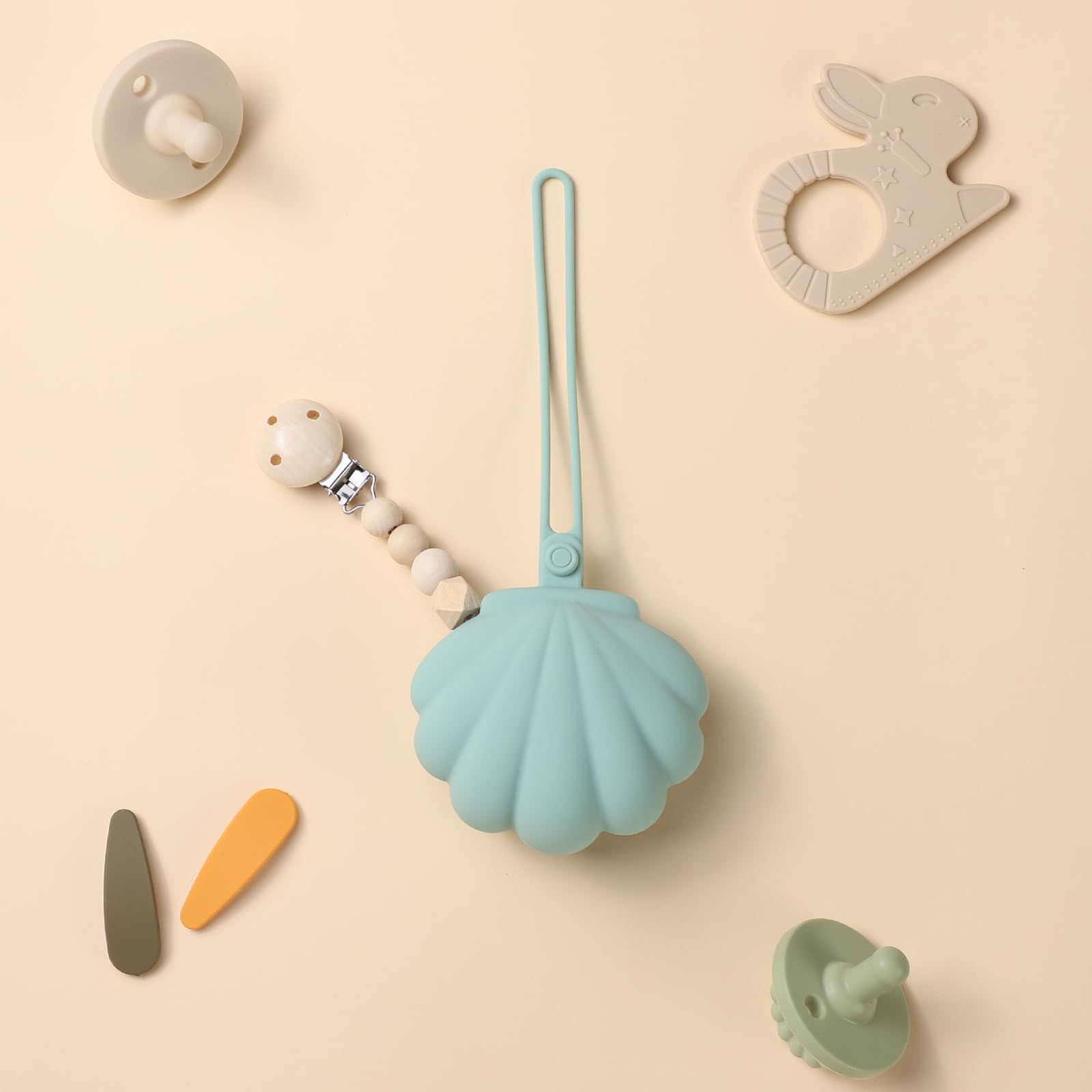 CLYMENE pacifier case organizes lip balm and hair ties during outings.