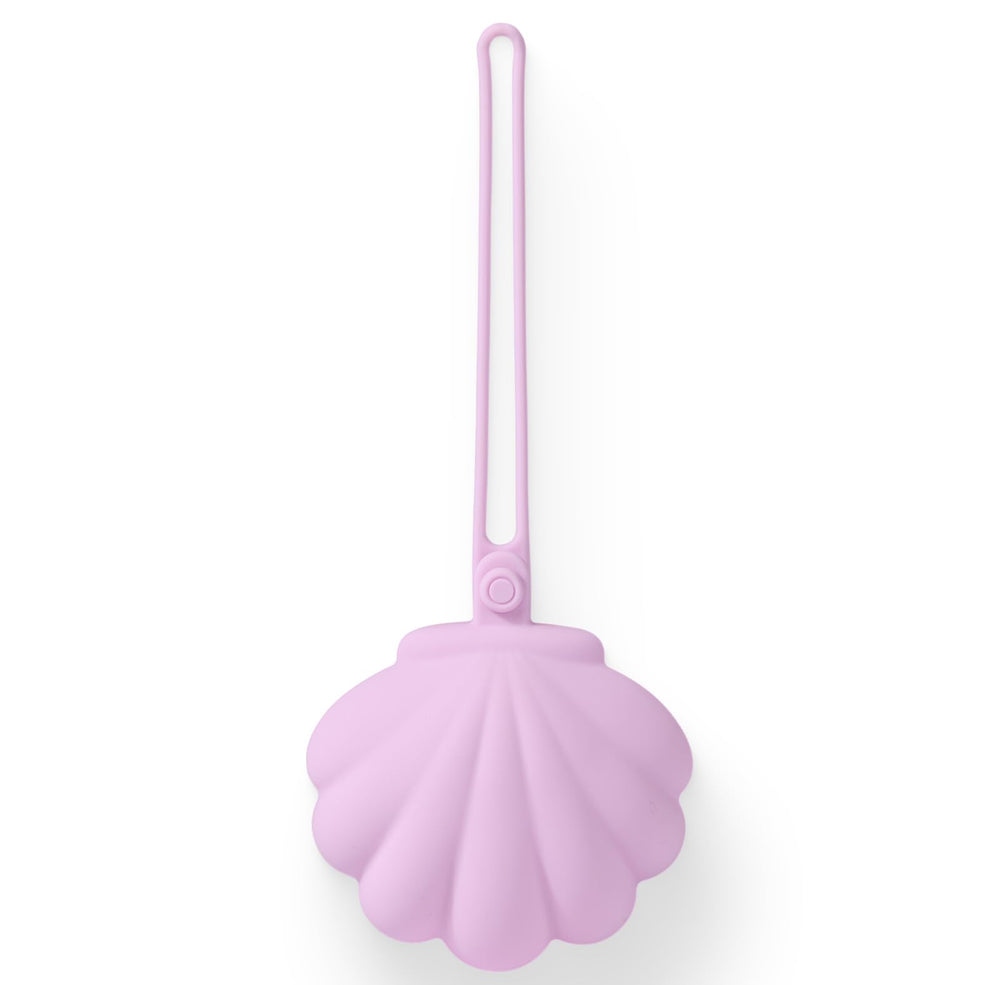 CLYMENE pacifier holder case with seashell silhouette keeps pacifiers clean and accessible.