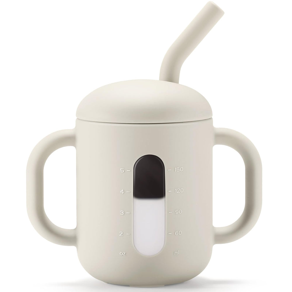CLYMENE silicone training cup with straw and handles in ivory, easy for tiny hands to grip.