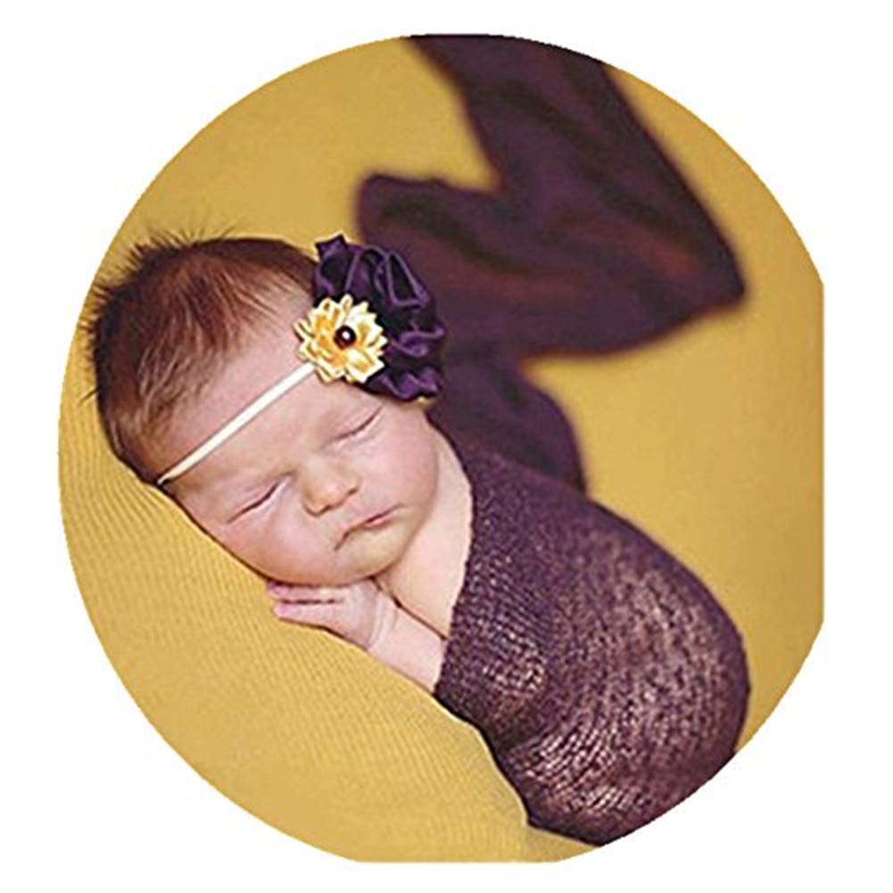 Coberllus newborn wrap dark purple used as a posing prop for newborn photos