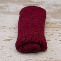 Coberllus newborn wrap red folded demonstrates versatility for quick posing setups.