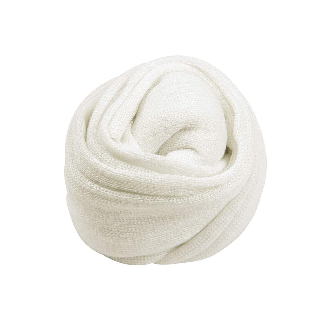 Coberllus white knit wrap displayed on posing setup for newborn sessions
