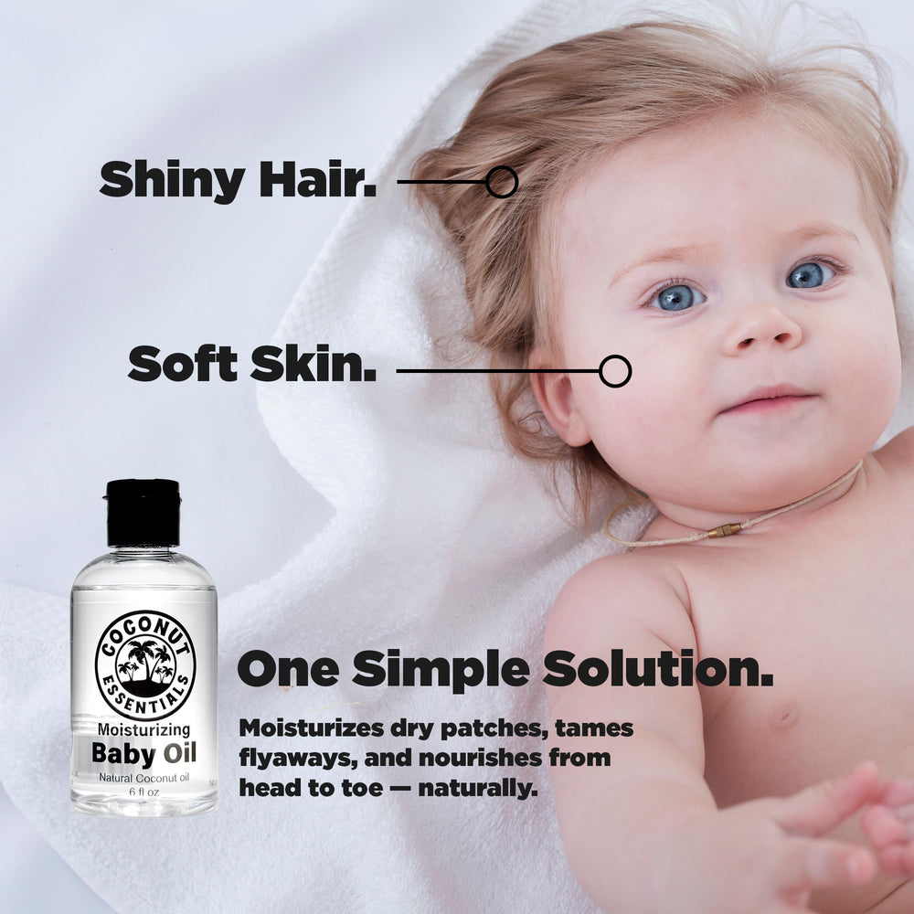 Coconut Essentials Baby Oil being applied during a gentle baby massage.