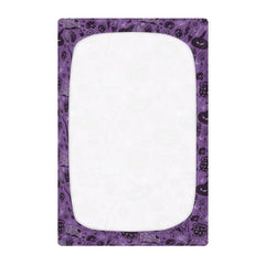 Coikll crib sheet demonstrates an elastic-band fit that stays in place.