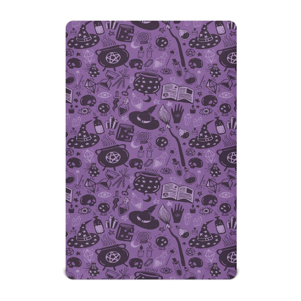 Coikll witch-themed fitted crib sheet on standard crib mattress with snug elastic edge.