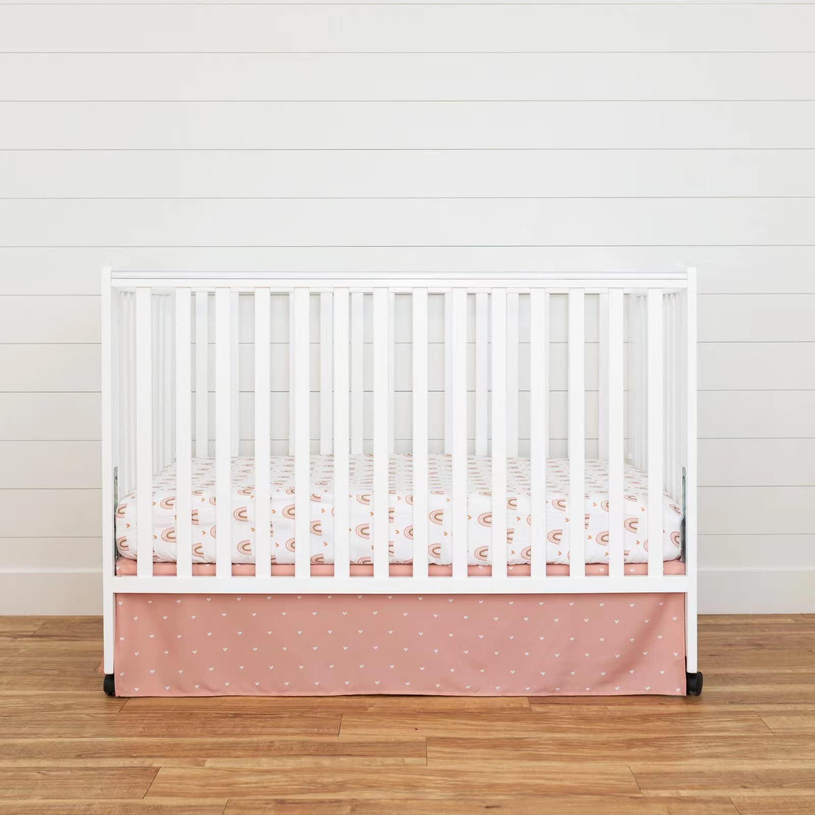 Cokouchyi boho nursery bedding set brightens the nursery atmosphere with rainbow accents.