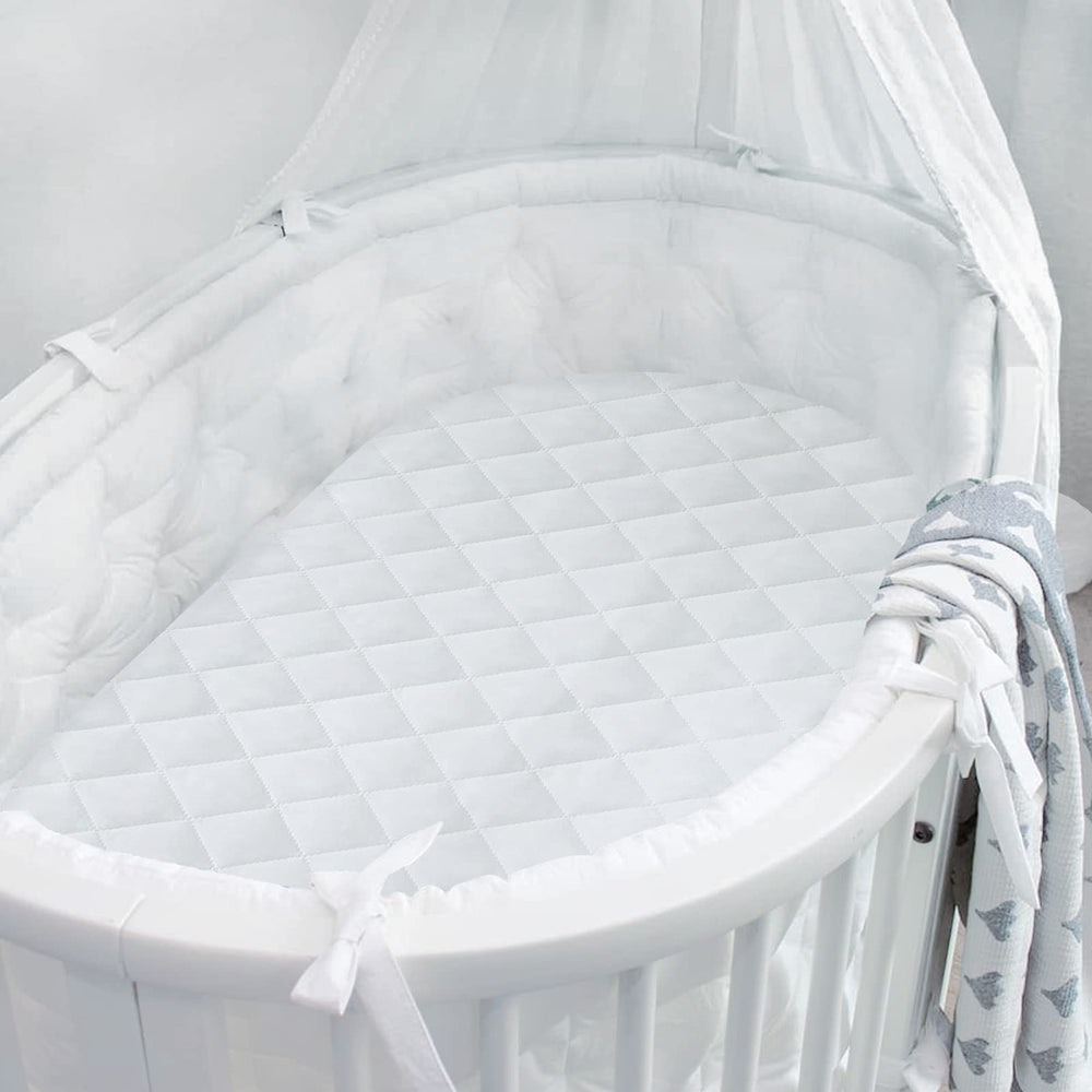 Coldwind durable bassinet mattress protector is dryer-safe for simple care