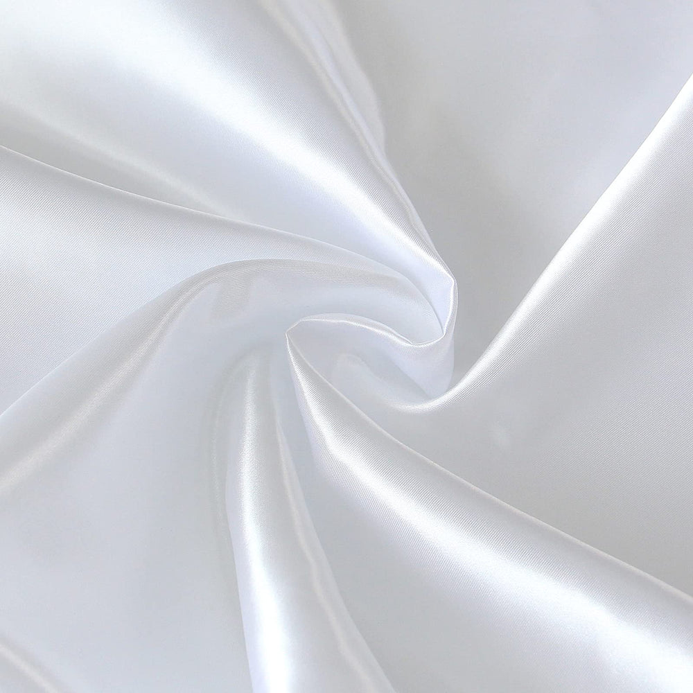 Coldwind satin crib sheet folded neatly, signaling quick setup and hassle-free change.