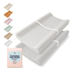 Comforista Muslin Changing Pad Cover 2-Pack on a changing table for soft, breathable protection.