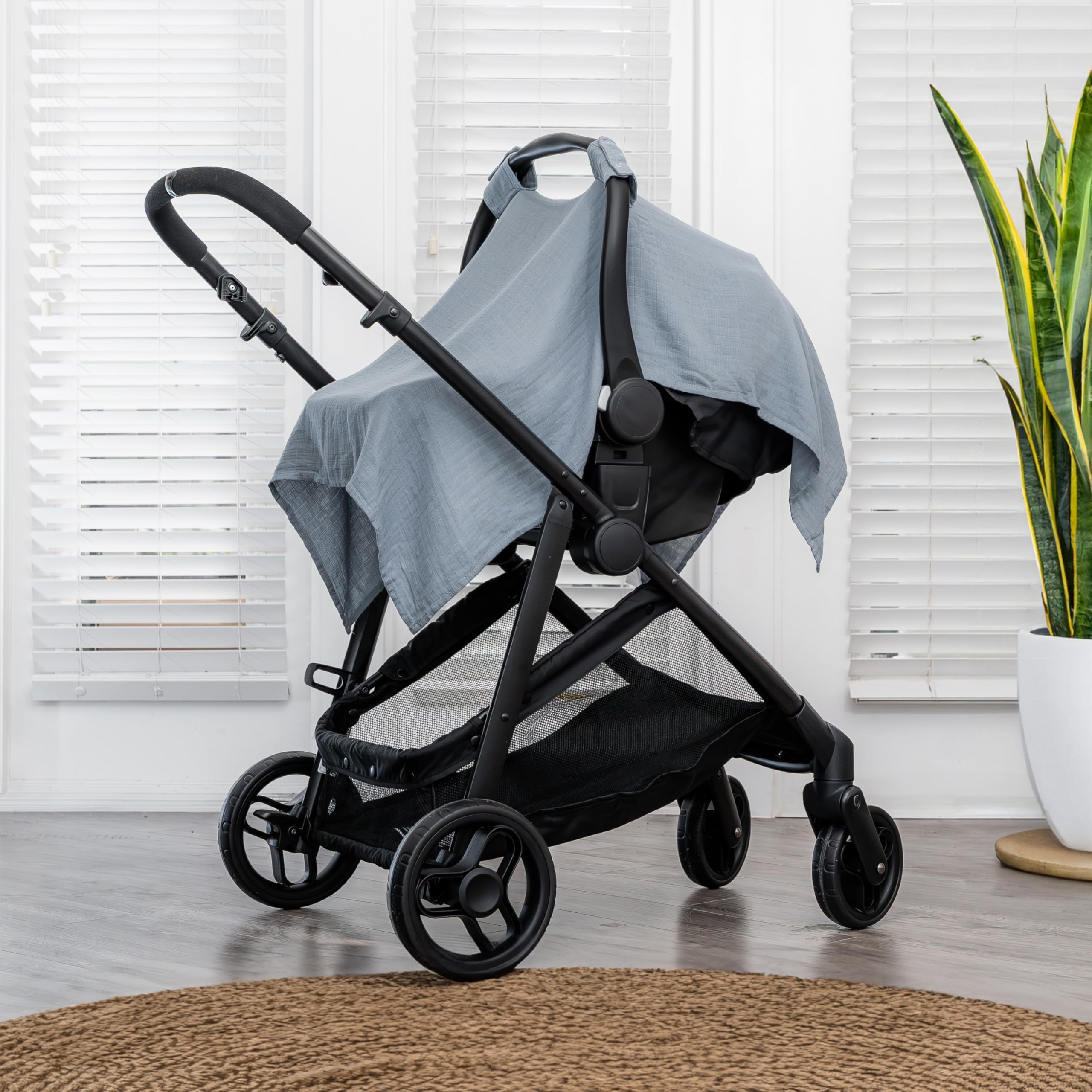 Comfy Cubs car seat cover with muslin cotton blend for breathable infant protection.