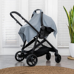 Comfy Cubs car seat cover with muslin cotton blend for breathable infant protection.