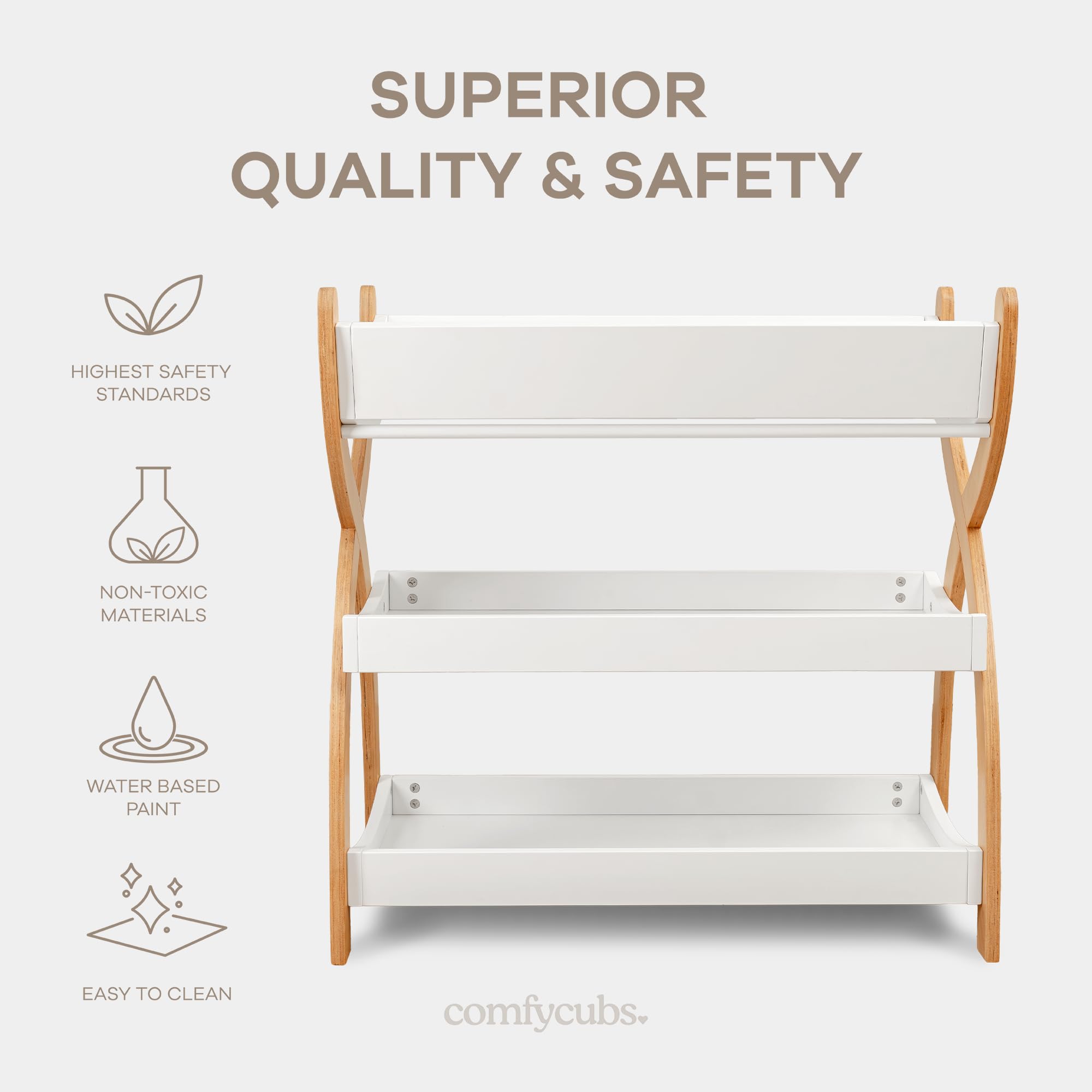 Comfy Cubs changing table in white with natural wood legs for versatile nursery styling.