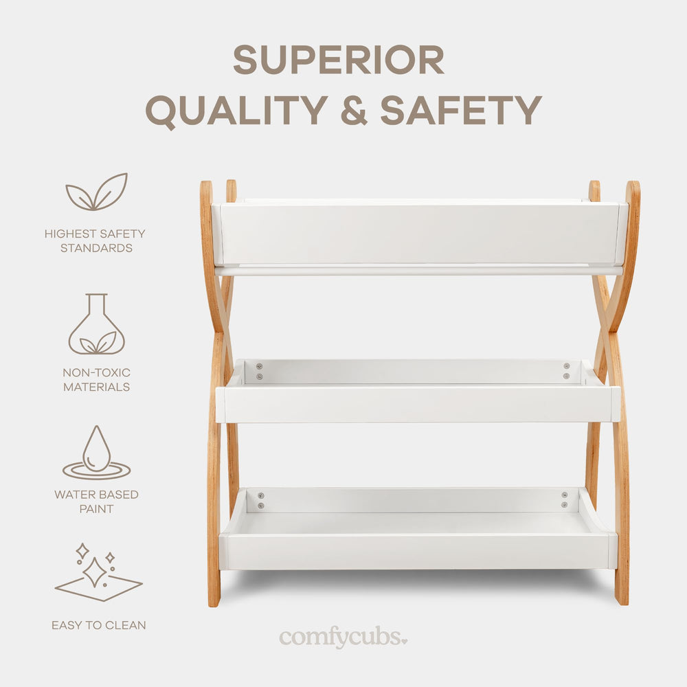 Comfy Cubs changing table in white with natural wood legs for versatile nursery styling.