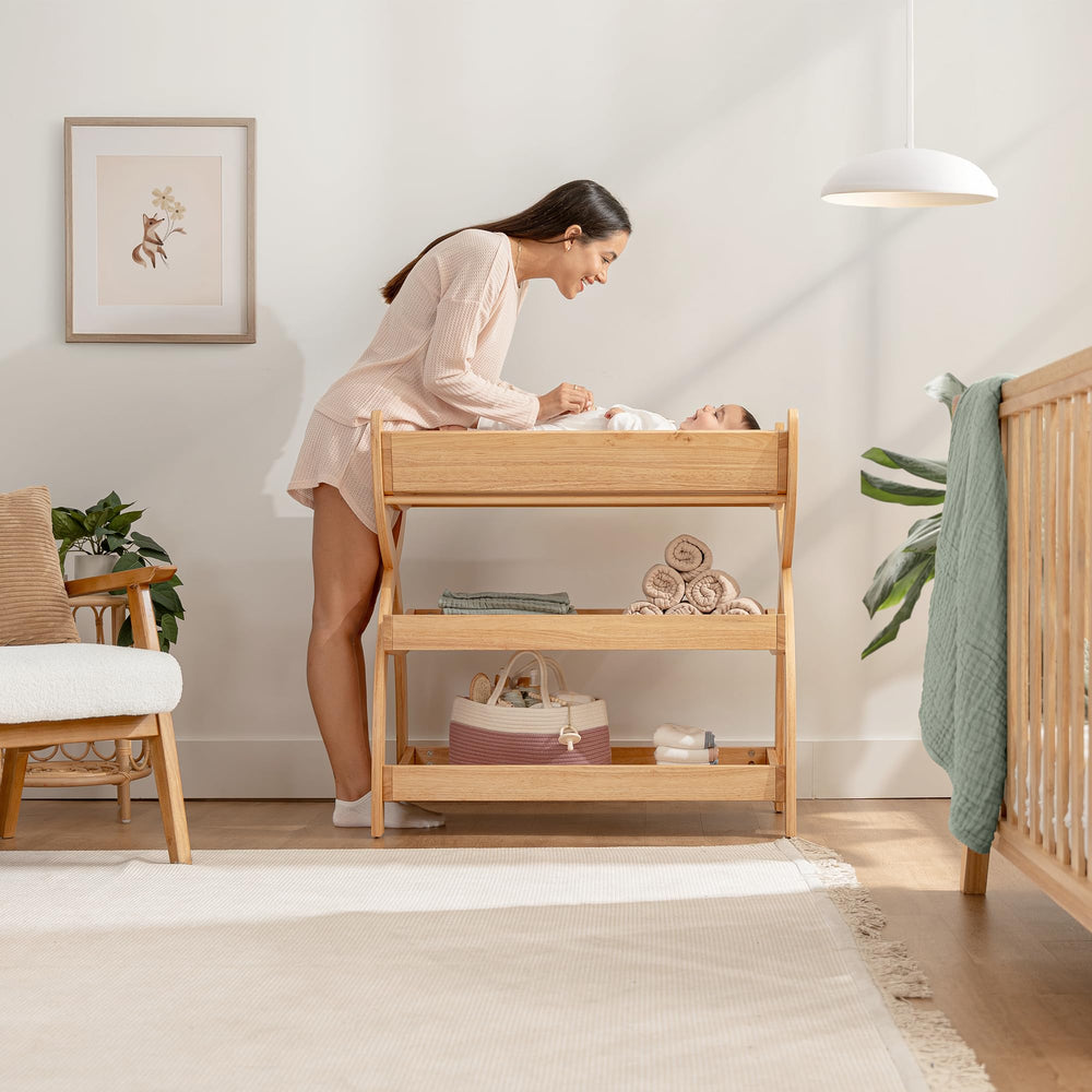 Comfy Cubs changing table with two open shelves keeps nappies within easy reach.