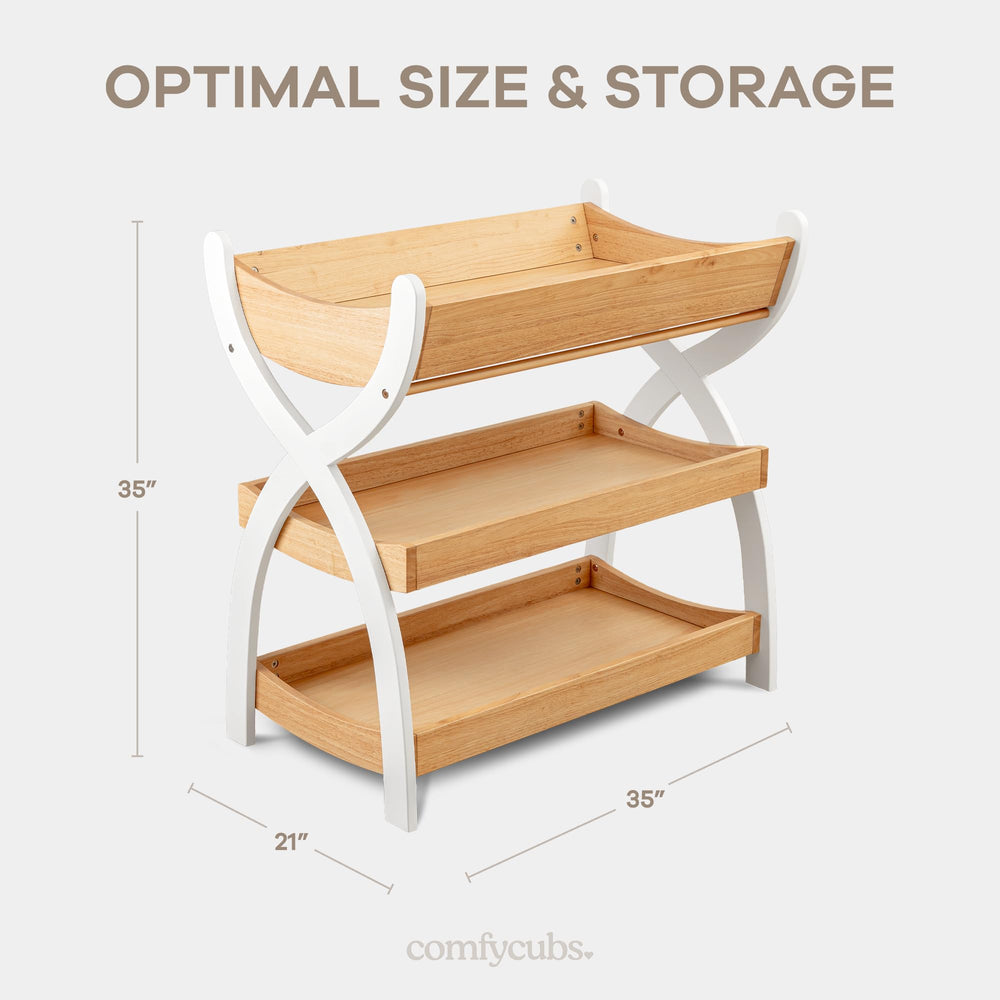 Comfy Cubs baby changing table with white legs adds a bright accent