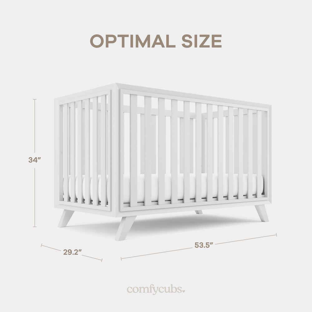 Two-tone white bars with natural wood legs on the Comfy Cubs crib