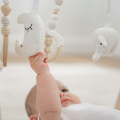 Comfy Cubs baby grasping toy closeup showcases fine motor exploration.