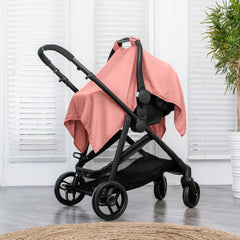 Comfy Cubs snap-closure demonstrates secure fit on a car seat.