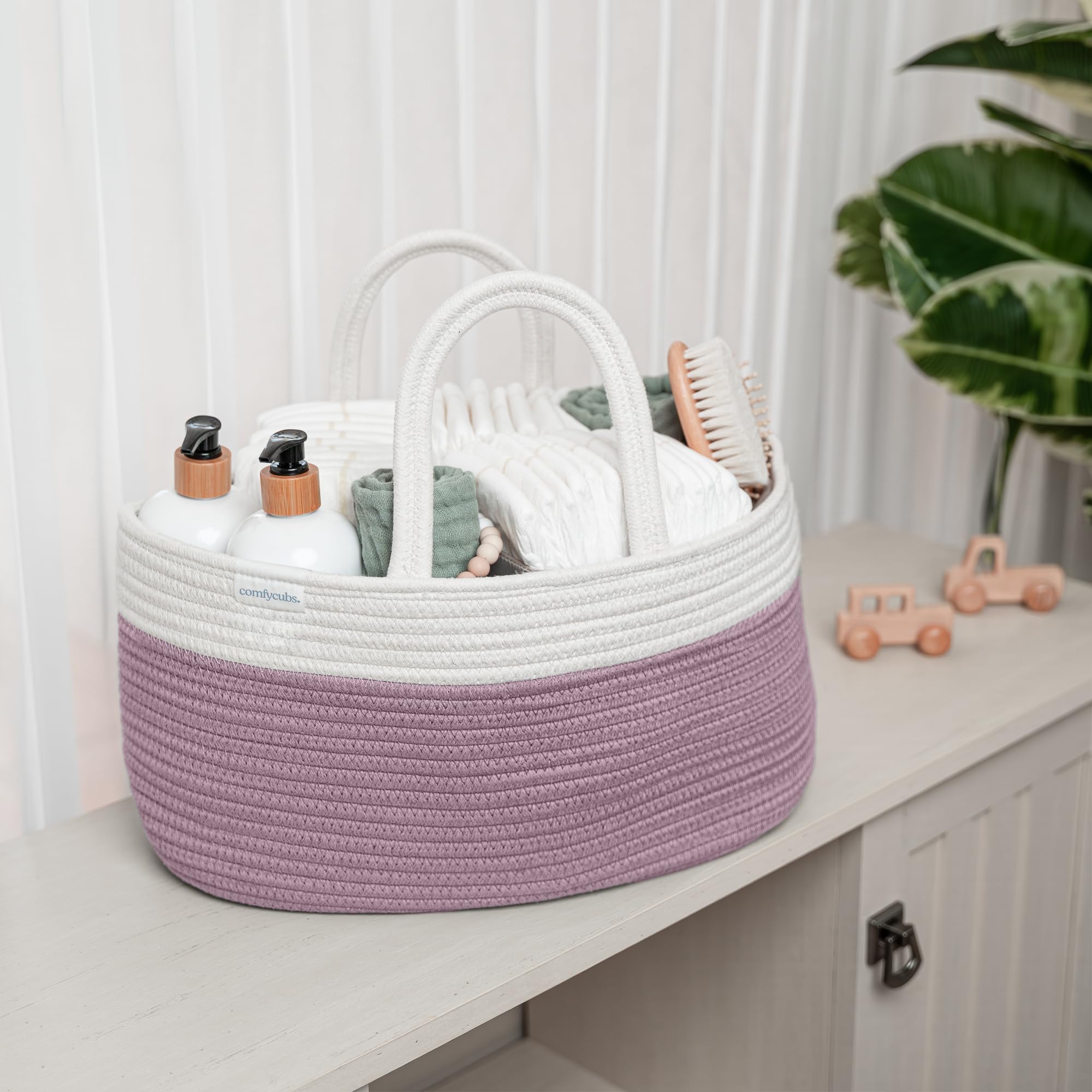 Comfy Cubs mauve diaper caddy adds subtle color to nursery decor.