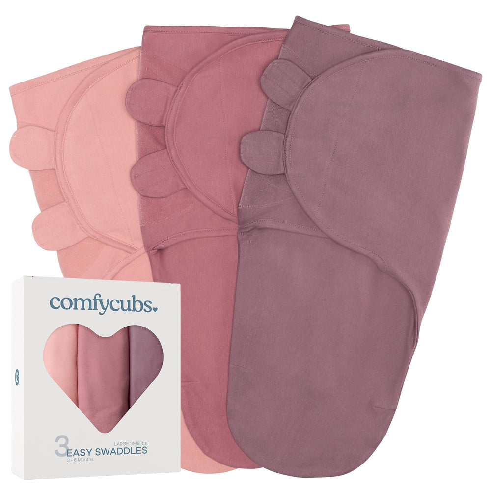 Comfy Cubs Easy Swaddle blush close-up showing soft 100% cotton fabric.