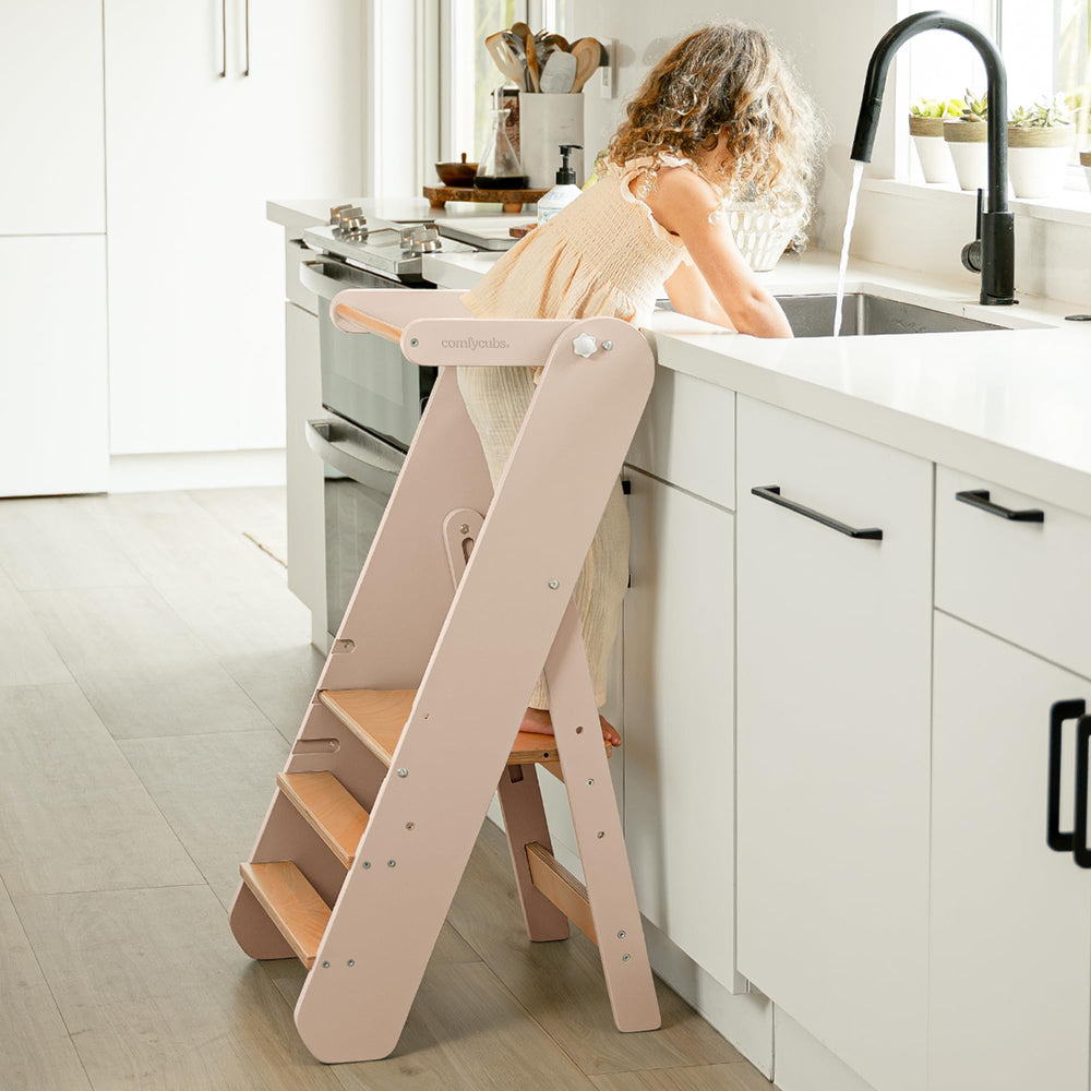 Comfy Cubs three-height-levels step stool for growing toddlers improves reach.