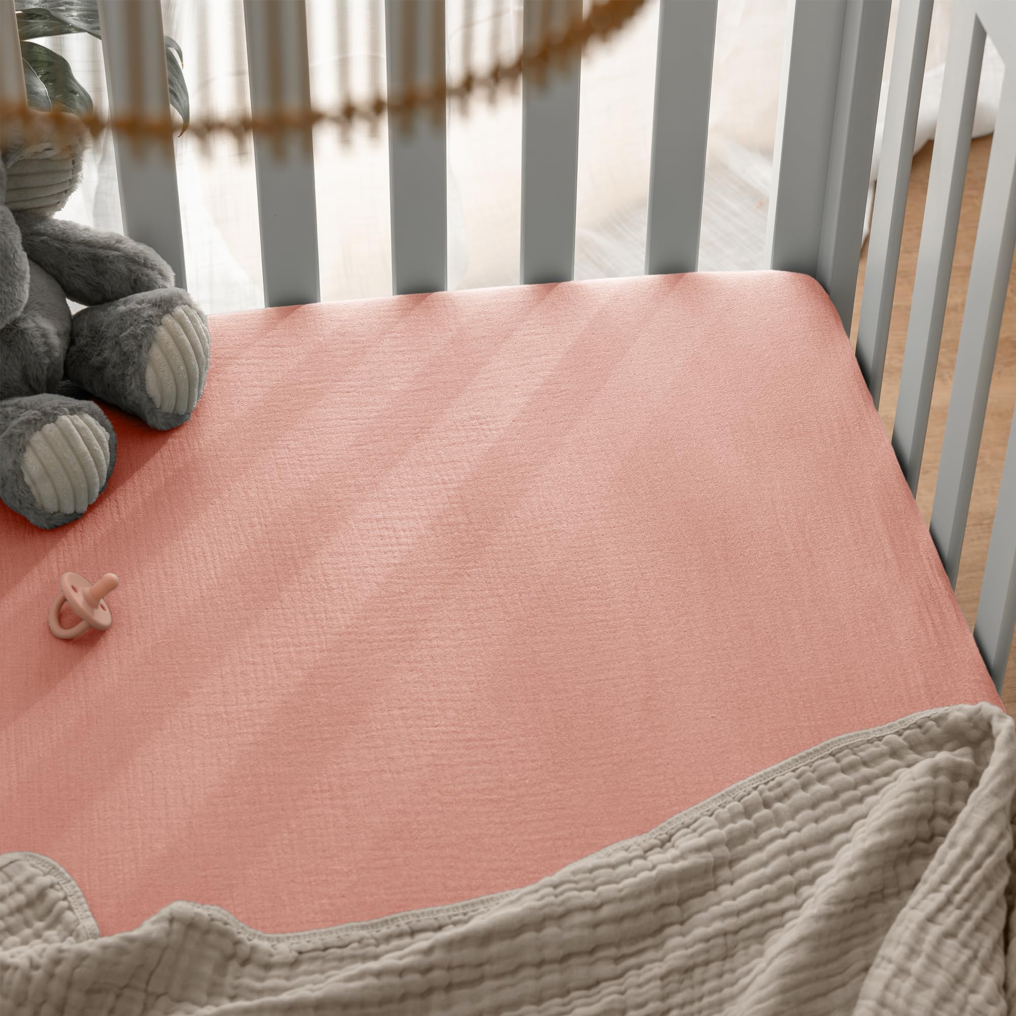 Comfy Cubs Lace Pink crib sheet on standard mattress provides breathable night comfort.