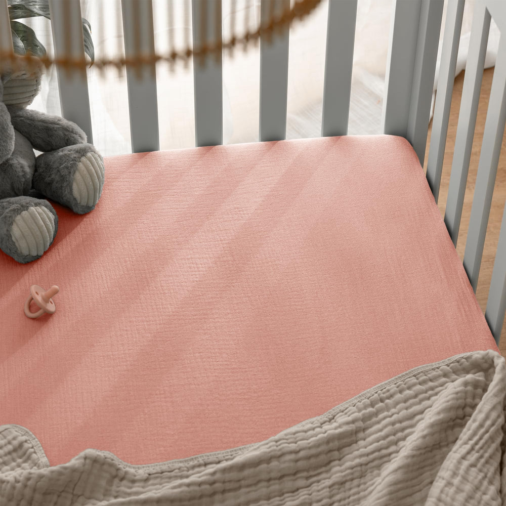 Comfy Cubs Lace Pink crib sheet on standard mattress provides breathable night comfort.