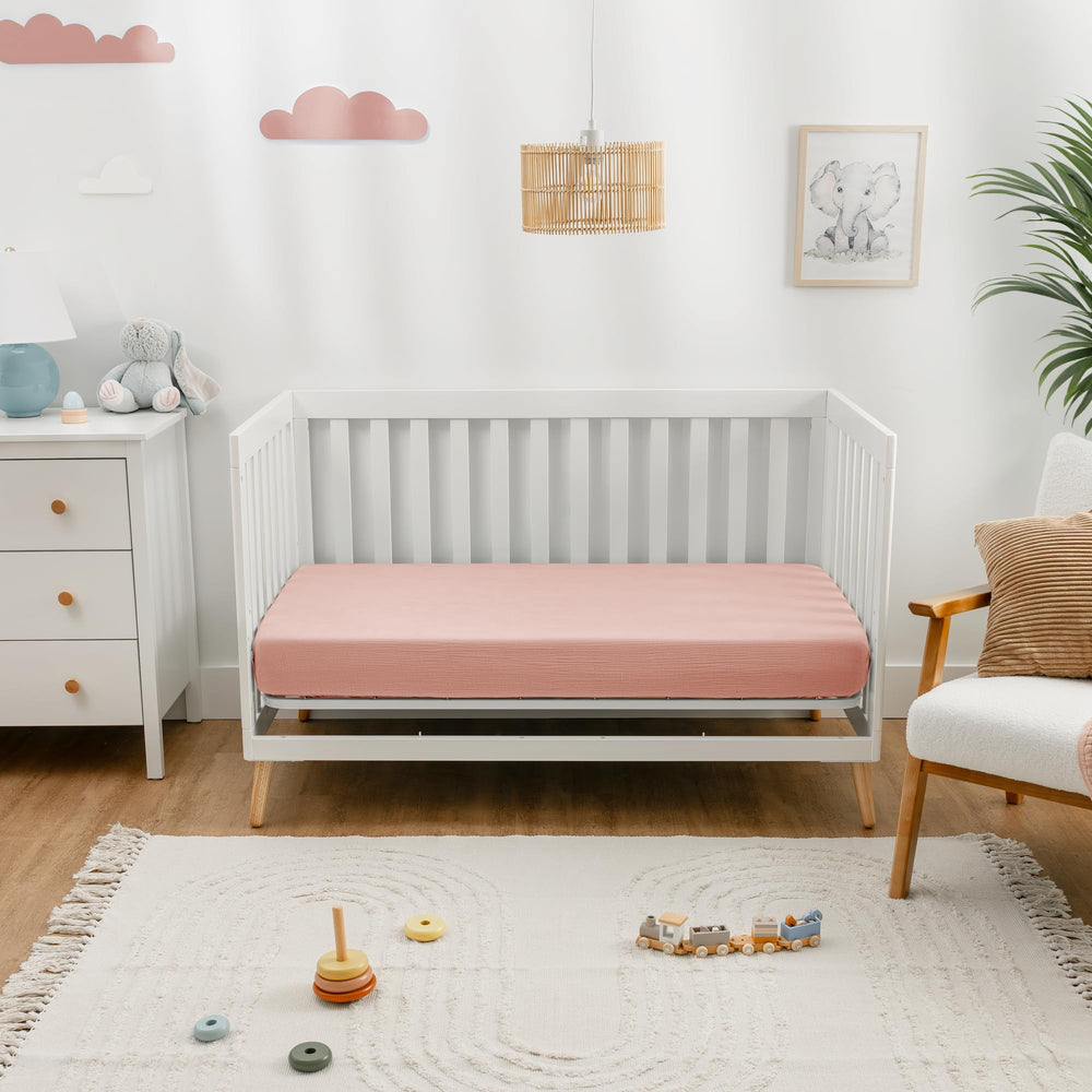 Comfy Cubs Lace Pink crib sheet folded for gifting in stylish packaging.
