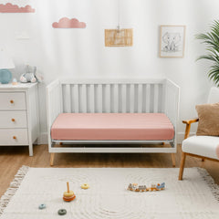 Comfy Cubs Lace Pink crib sheet folded for gifting in stylish packaging.