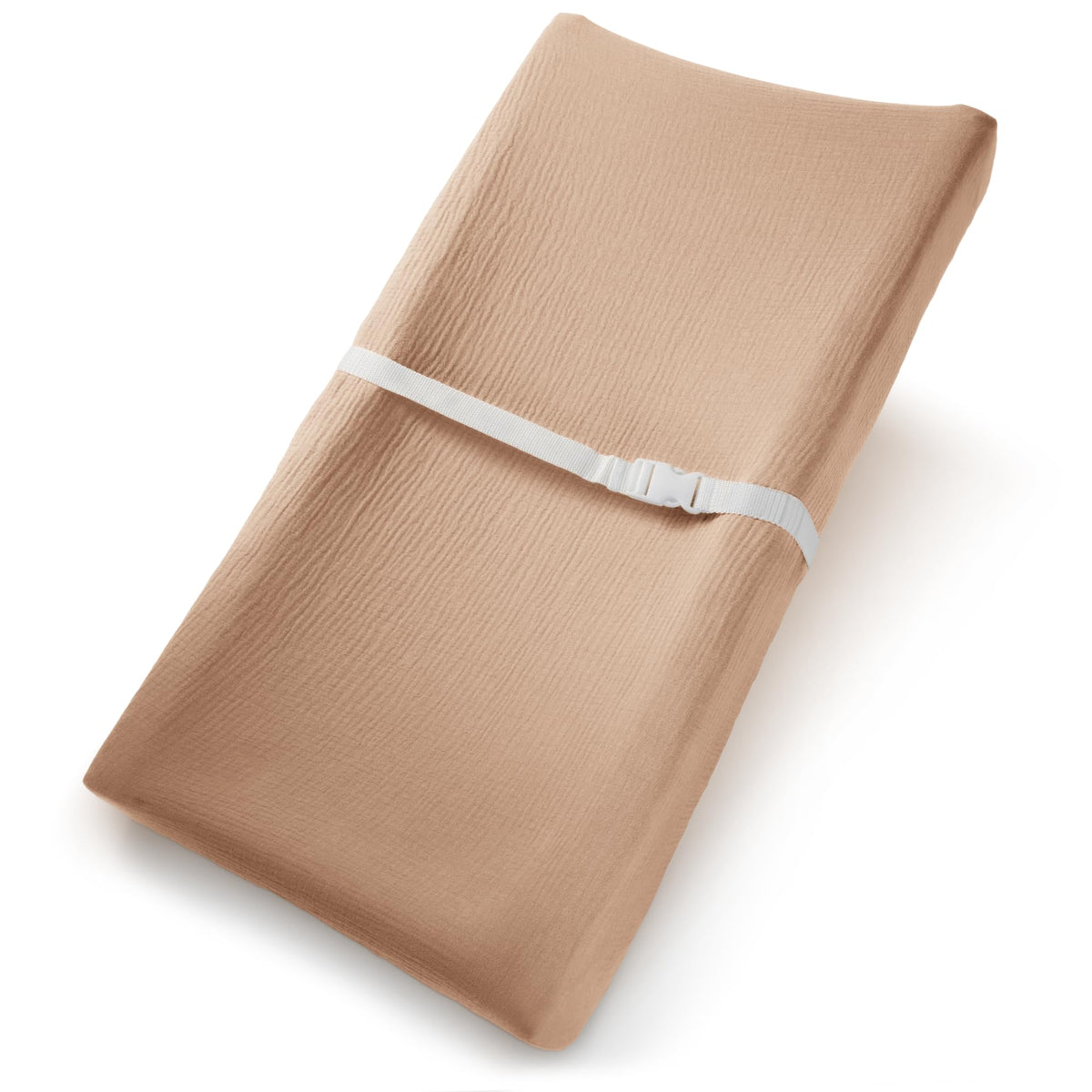 Comfy Cubs muslin changing pad cover on cedar pad, breathable cotton for gentle diaper changes.