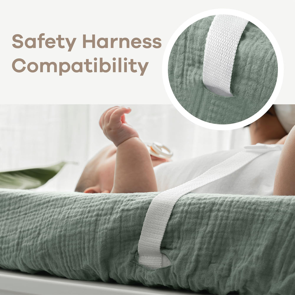 Comfy Cubs fern changing pad cover with safety strap openings for secure diaper changes.
