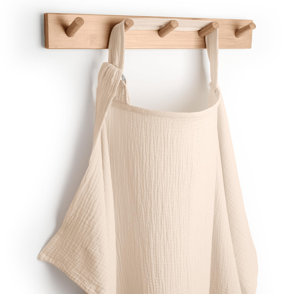 Comfy Cubs Muslin Nursing Cover in sand color, soft and breathable.