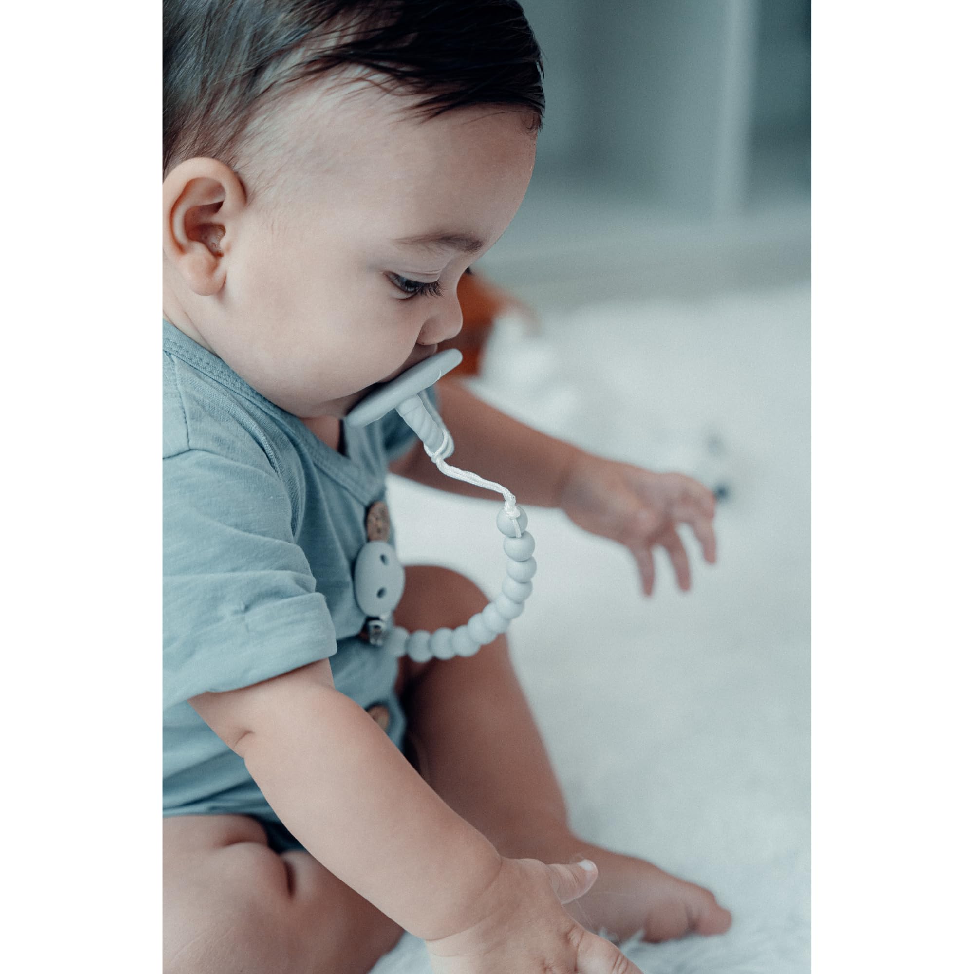 Comfy Cubs pacifier clip closeup shows food-grade silicone for safe teething moments.