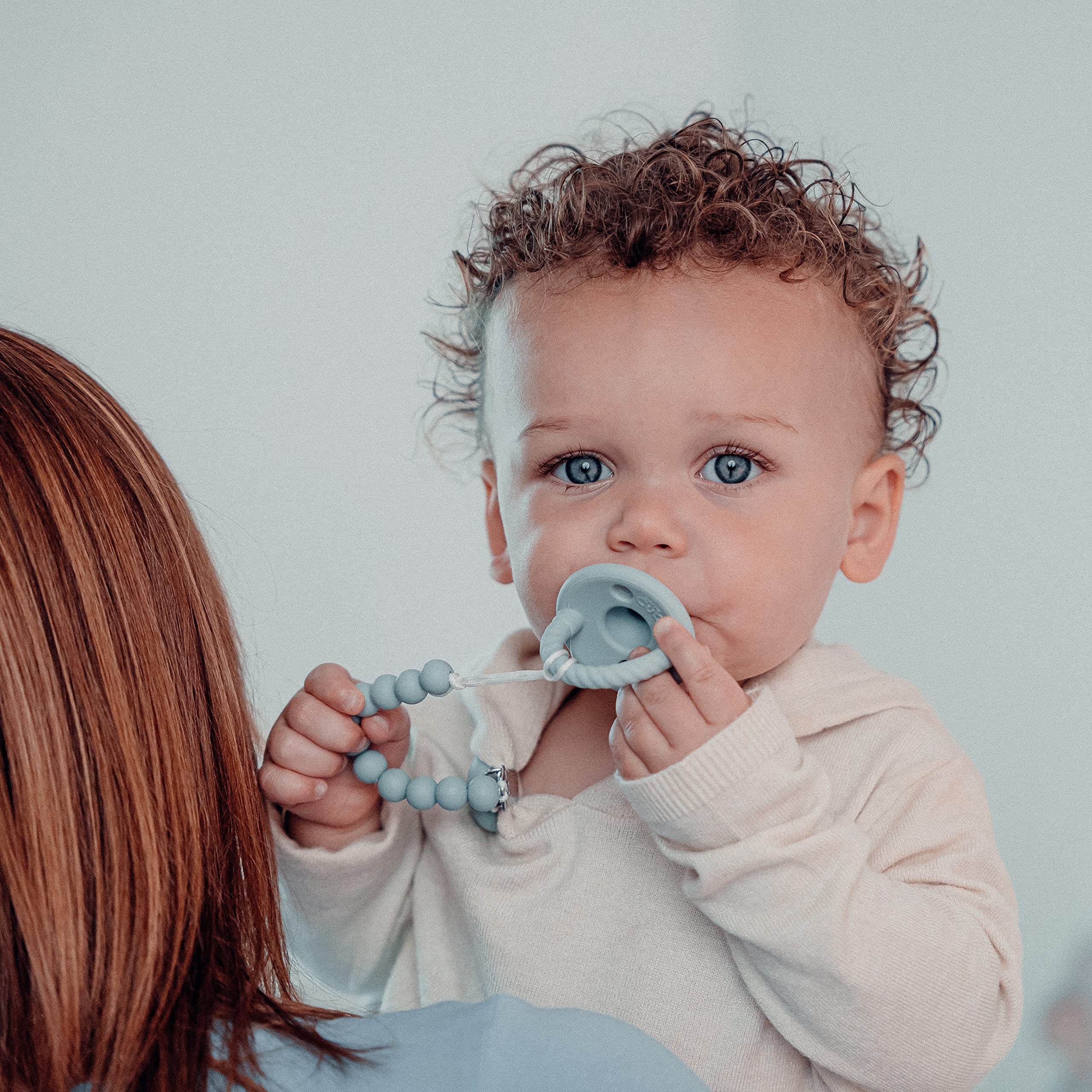 Comfy Cubs pacifier clip in action keeps pacifier reachable and secure.