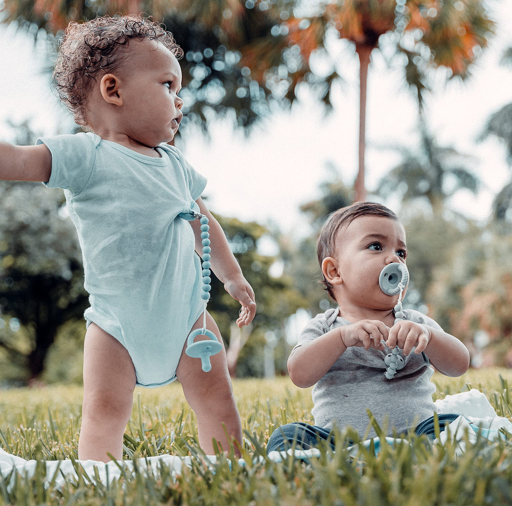 Comfy Cubs silicone pacifier clip flexible material for everyday wear.