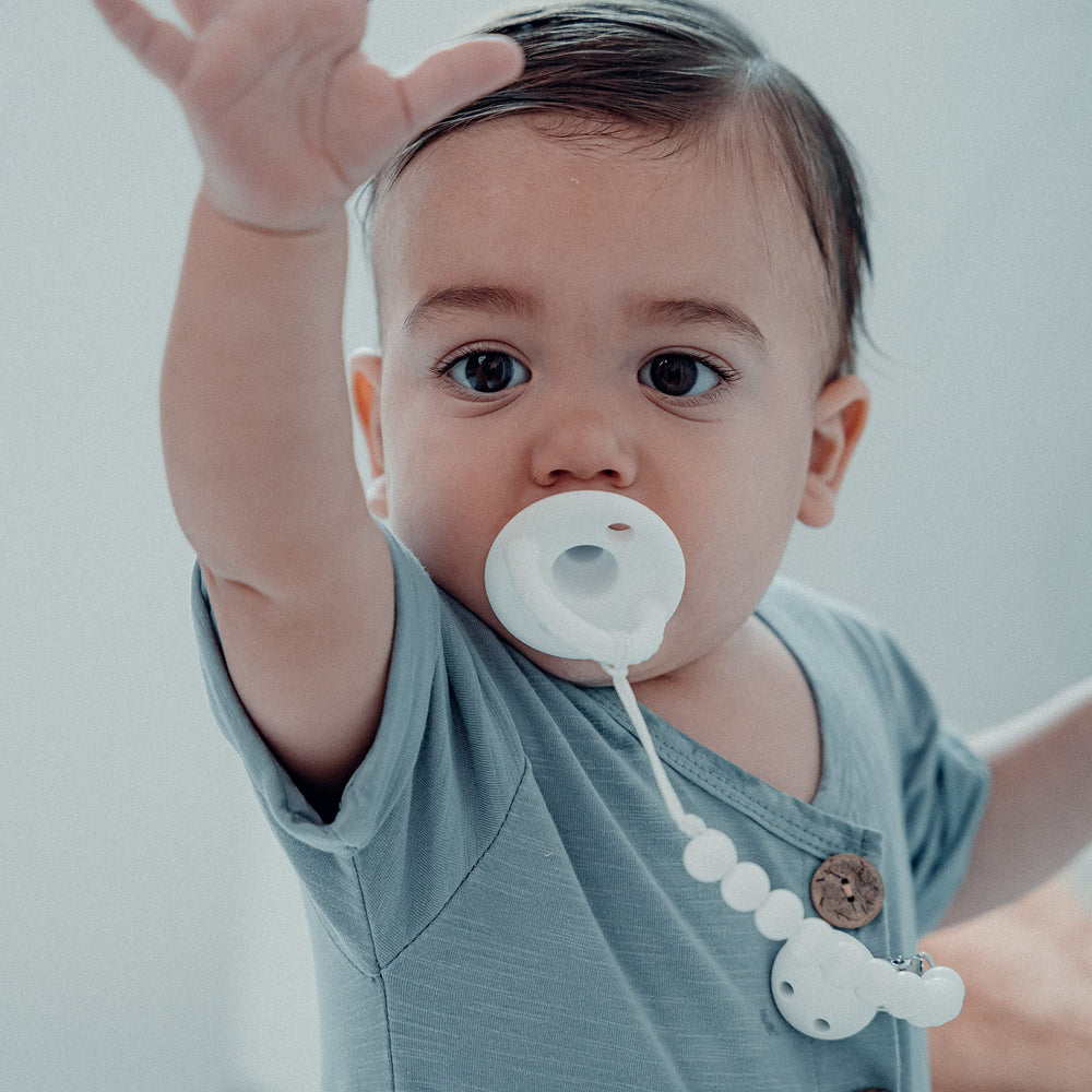 Comfy Cubs CPSIA-certified clips beside packaging signal safety and quality standards.