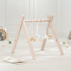 Comfy Cubs wooden play gym with natural pinewood finish promotes safe, engaging exploration.