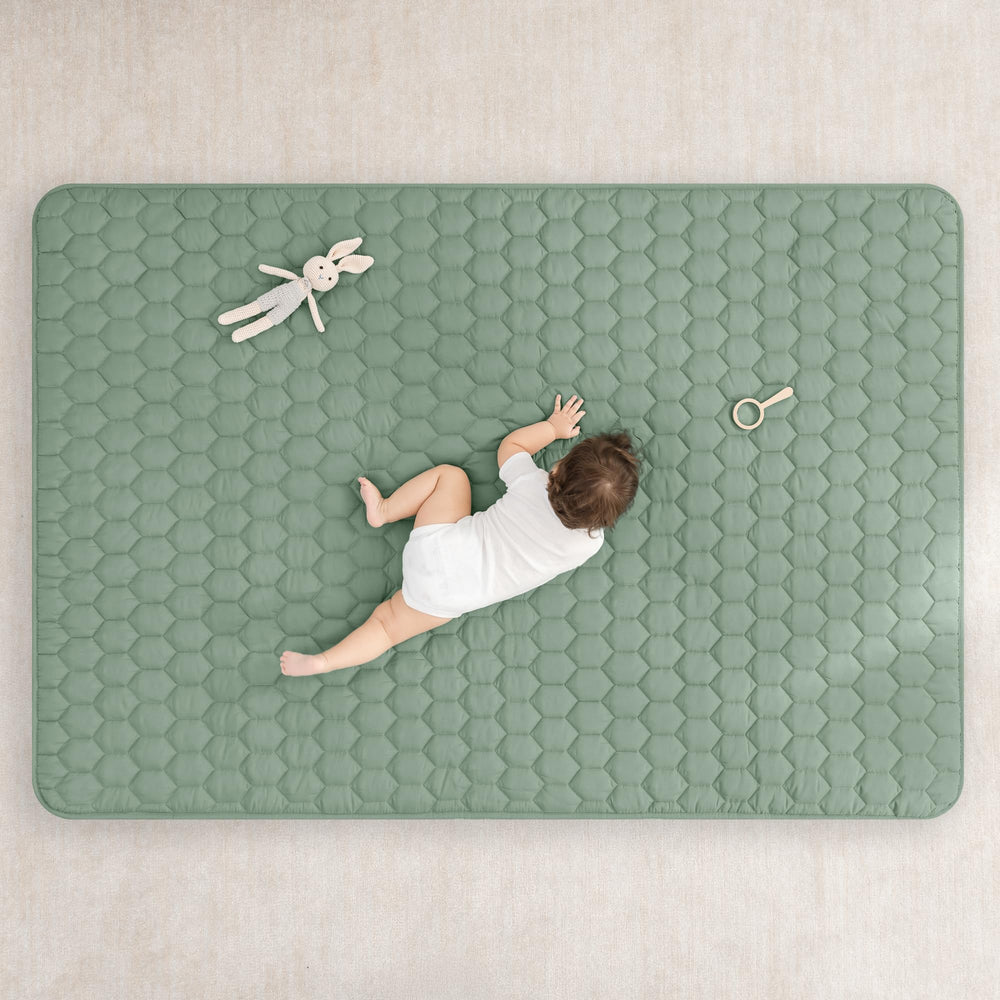 Comfy Cubs rectangle play mat closeup, quilt stitching for cushioned comfort.