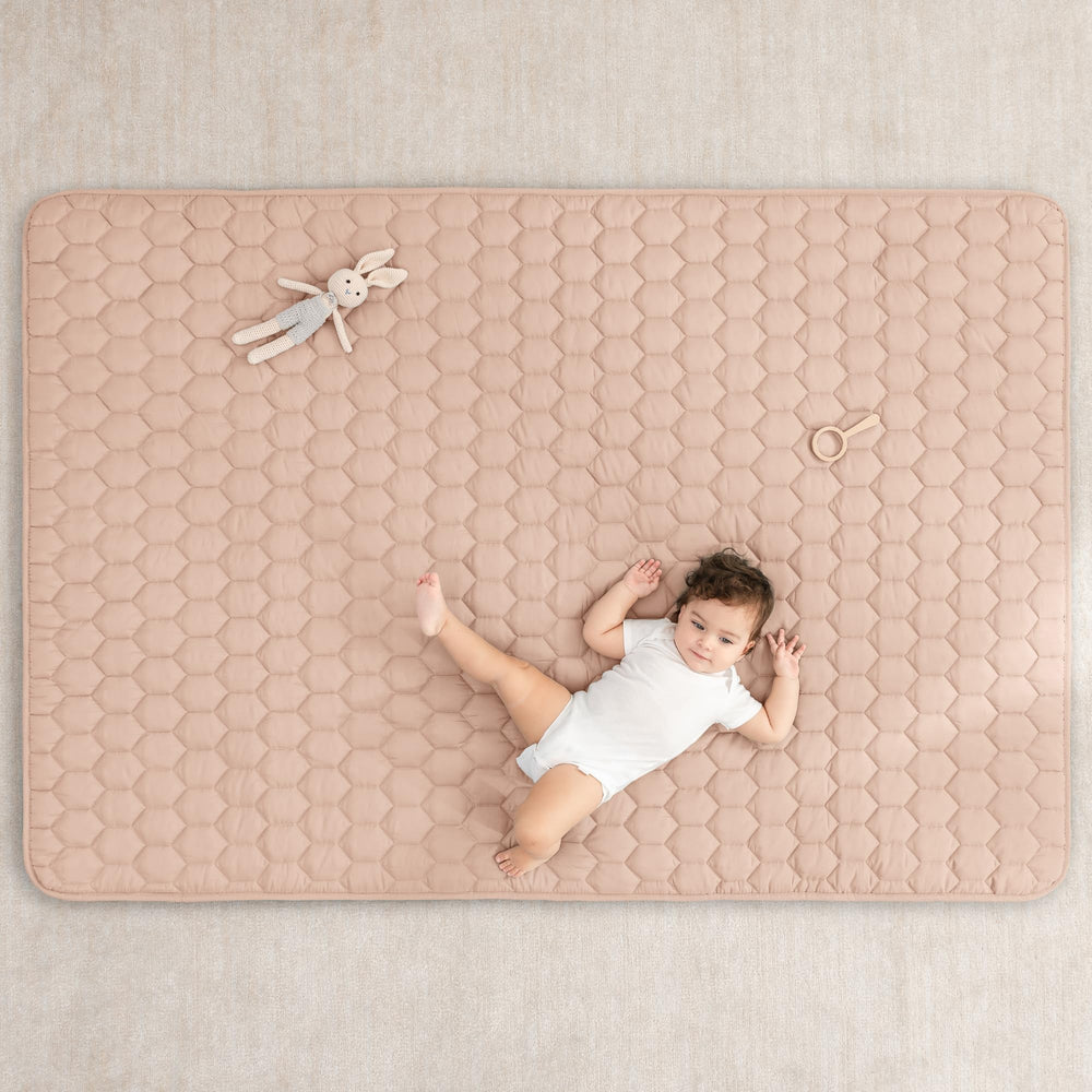 Non-slip bottom keeps the mat stable on smooth floors for safe play.