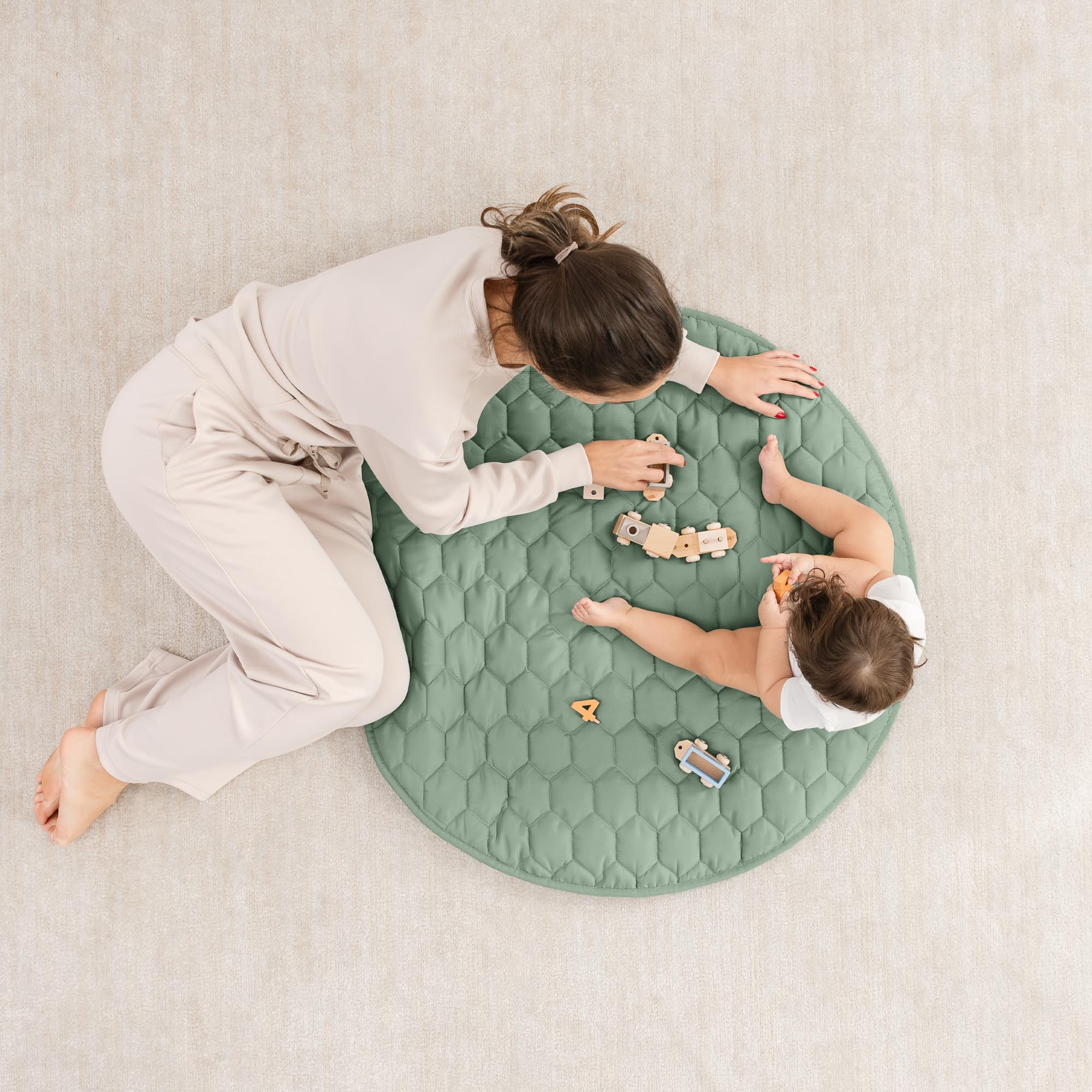 Quilted Fern round mat cushions tummy time and crawls