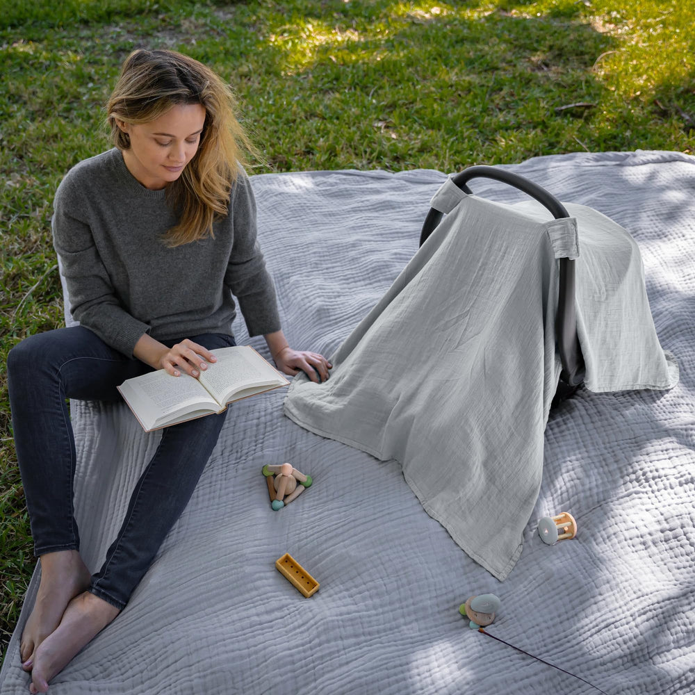 Comfy Cubs car seat cover features a secure snap closure to stay in place.