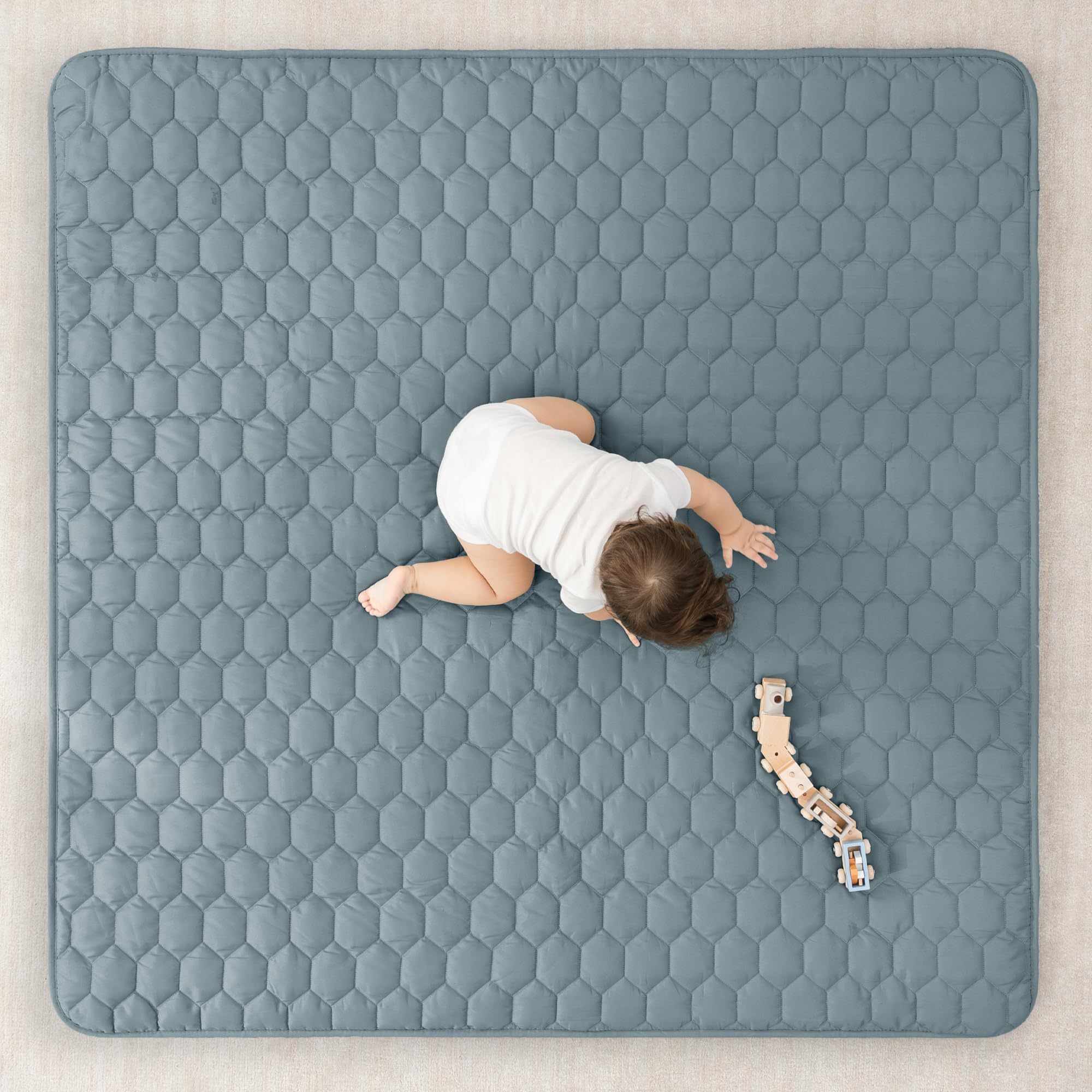Comfy Cubs quilted-top mat adds extra padding for comfy crawls.