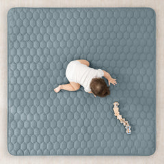 Comfy Cubs quilted-top mat adds extra padding for comfy crawls.