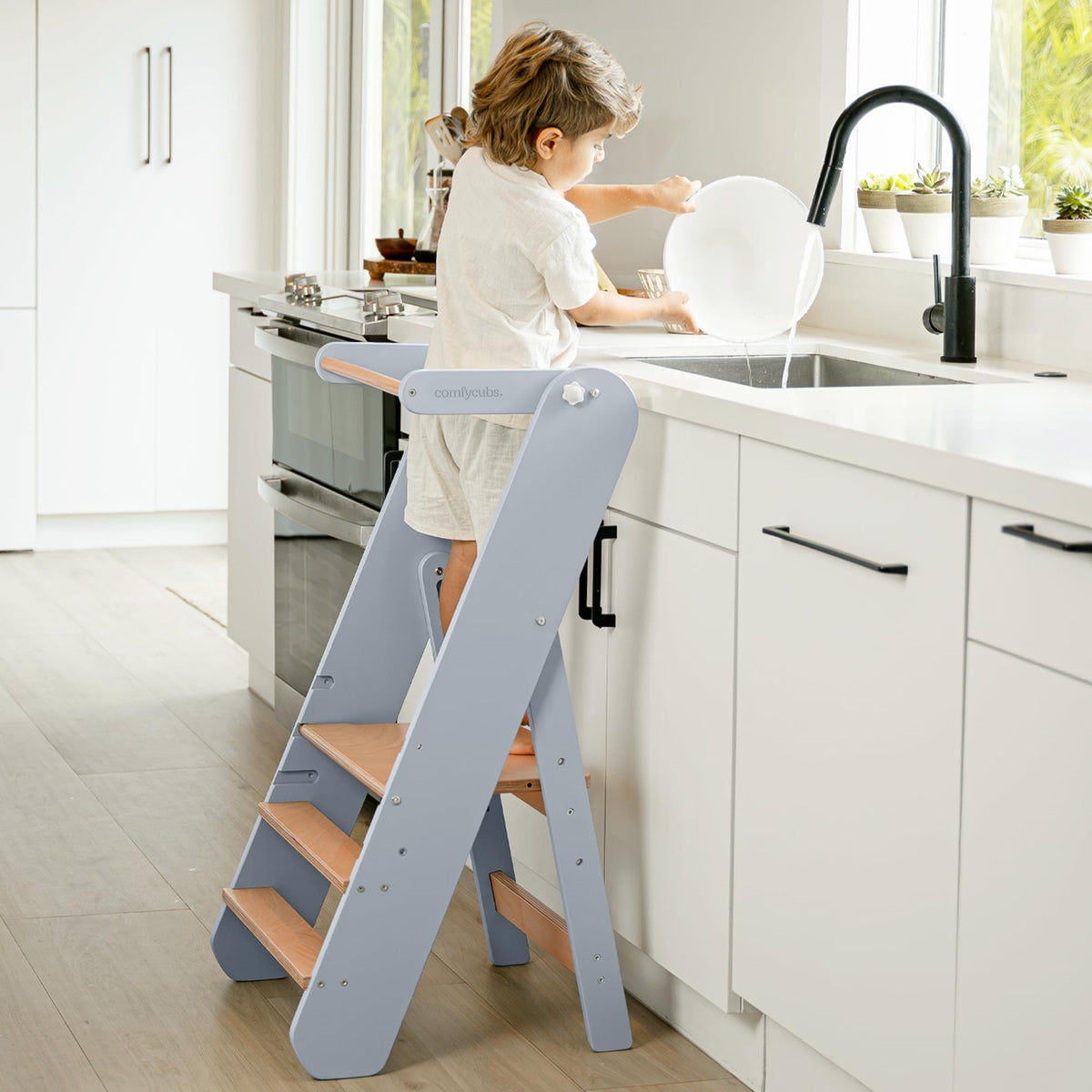 Comfy Cubs step stool with three heights helps kids reach sinks safely.