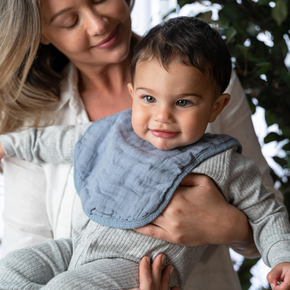 Comfy Cubs unisex Pacific Blue bibs add color to outfits.