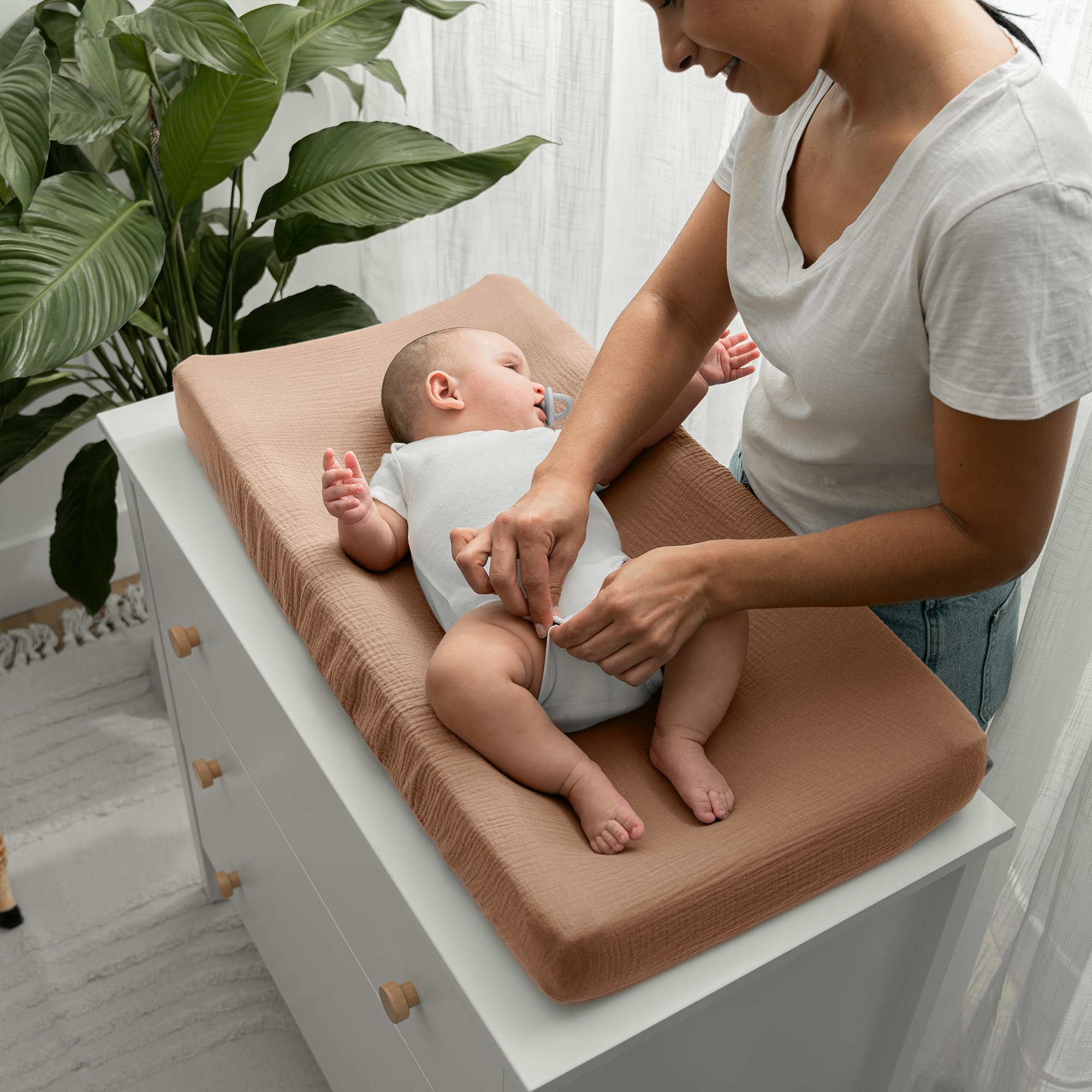Comfy Cubs universal-fit changing pad cover showing elastic edges for secure placement.